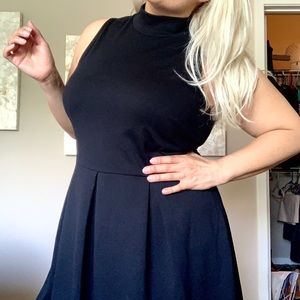 Sleeveless black turtleneck dress